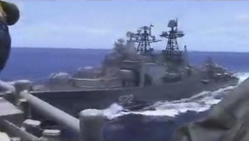 In this image from video provided by the U.S. Navy, a Russian destroyer, left, sails very close to the USS Chancellorsville, right, while operating in the Philippine Sea, Friday, June 7, 2019. The U.S. and Russian militaries accused each other of unsafe actions in the incident. (Photo by Petty Officer 1st Class Christopher J Krucke via AP)