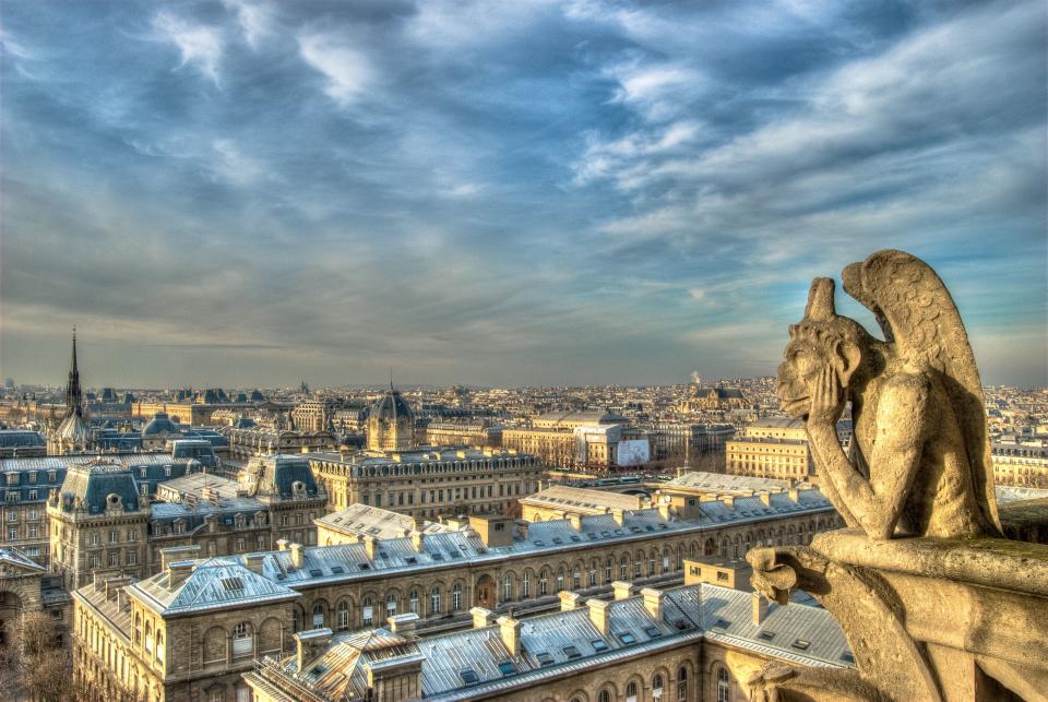 The Stryge grotesque peering down contemplatively at the rooflines of Paris from the top of Notre-Dame.