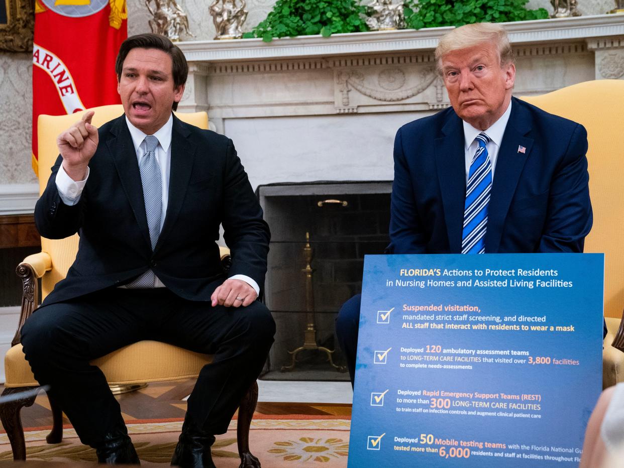 Florida Gov. Ron DeSantis (L) speaks while meeting with U.S. President Donald Trump in the Oval Office of the White House on April 28, 2020 in Washington, DC (Getty Images)