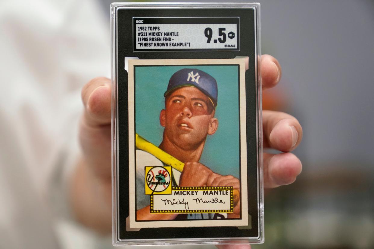 A Mickey Mantle baseball card is displayed at Heritage Auctions in Dallas, on July 21, 2022. A mint-condition Mickey Mantle baseball card has sold for $12.6 million, blasting into the record books Sunday Aug. 28, 2022, as the most expensive ever paid for a piece of sports memorabilia.