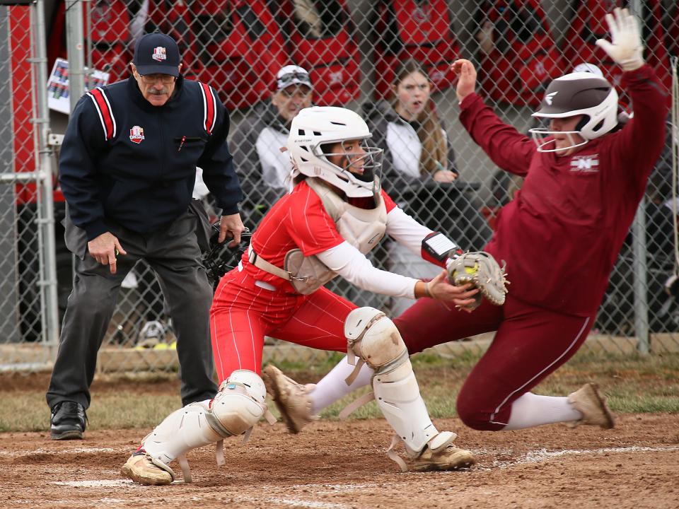 Johnstown's Addy Zak forces out Newark's Calyn Music at home during the host Johnnies' 15-8 victory on Saturday, April 6, 2024.