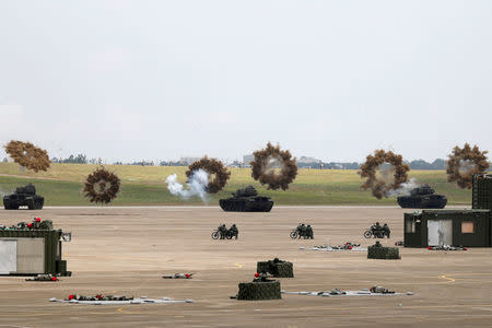 M60A3 tanks fire smoke bombs during Han Kuang military drill simulating the China's People's Liberation Army (PLA) invading the island, at Ching Chuan Kang Air Base, in Taichung, Taiwan June 7, 2018. REUTERS/Tyrone Siu