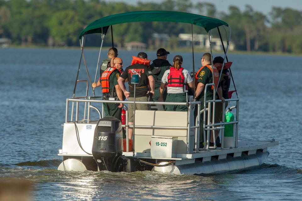 Polk County Sheriff Underwater Search & Recovery Team heads toward the search area where an aircraft crashed into Lake Hartridge after colliding with another aircraft this afternoon in Winter Haven Fl  Tuesday March 7,2023.There has been one confirmed fatality and divers are searching for the other plane which sank.Ernst Peters/The Ledger