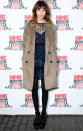 <b>Alexa Chung</b><br><br>Alexa rocked up to the iconic NME Awards in a taupe fur coat, Valentino blue lace dress and black opaque tights and chunky heels.<br><br> © REX