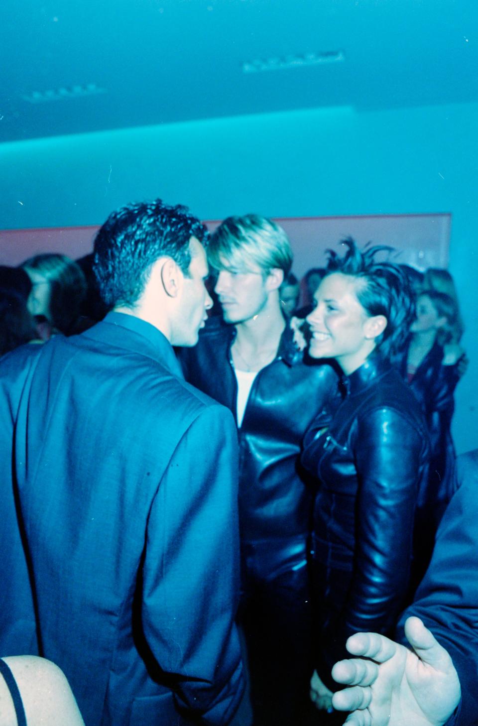 David Beckham and Victoria Beckham attend a party at the Versace Jeans Couture retail store in London, England, on June 16, 1999.