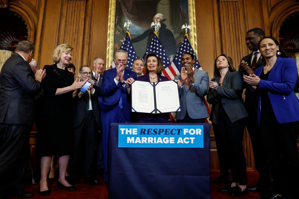 House Speaker Nancy Pelosi (D-CA) participates in a bill enrollment ceremony alongside Senate Majority Leader Chuck Schumer (D-NY) and a bipartisan group of Senators and Representatives for the Respect For Marriage Act at the U.S. Capitol Building on December 08, 2022 in Washington, DC.
