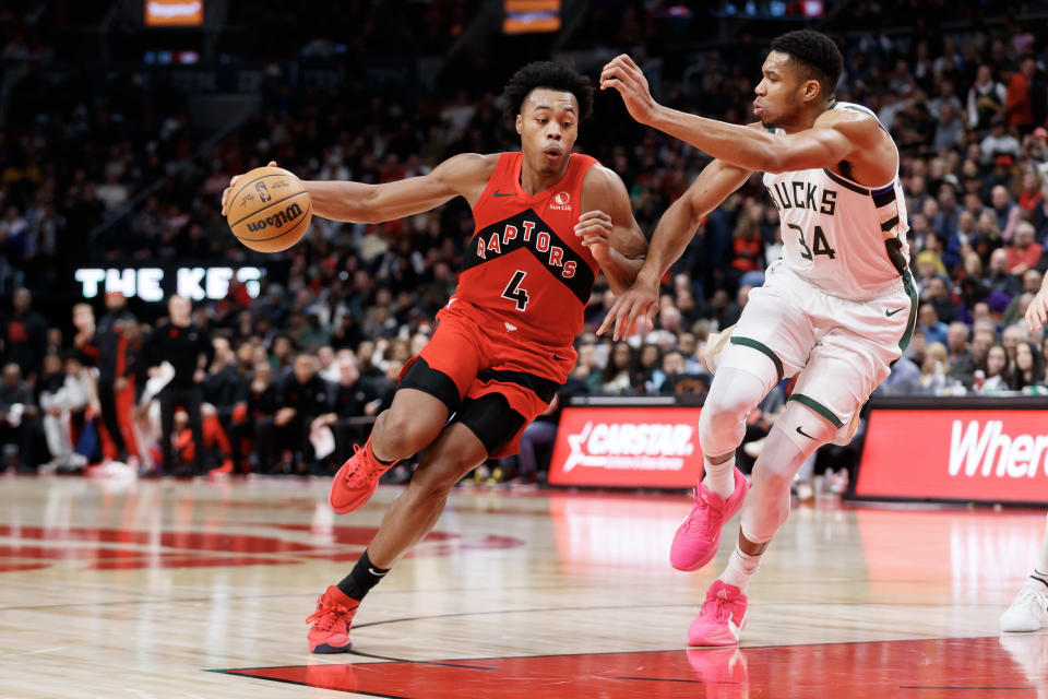 TORONTO, CANADA - NOVEMBER 1: Scottie Barnes #4 of the Toronto Raptors drives to the net against Giannis Antetokounmpo #34 of the Milwaukee Bucks during the first half of their NBA game at Scotiabank Arena on November 1, 2023 in Toronto, Canada. NOTE TO USER: User expressly acknowledges and agrees that, by downloading and or using this photograph, User is consenting to the terms and conditions of the Getty Images License Agreement. (Photo by Cole Burston/Getty Images)