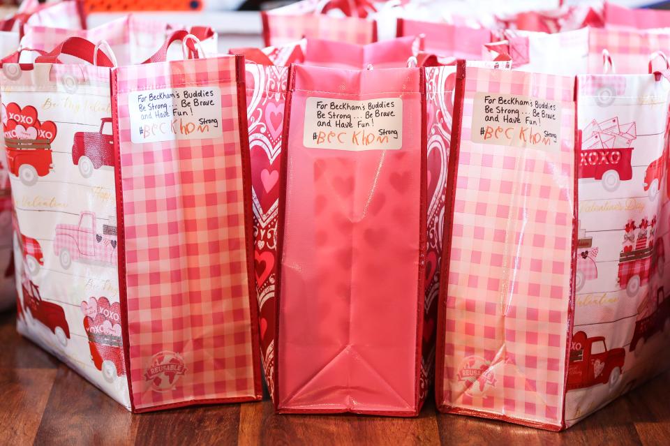 Bags filled with candy and cards crafted by Beckham Goodale are ready for delivery. Feb. 9, 2022