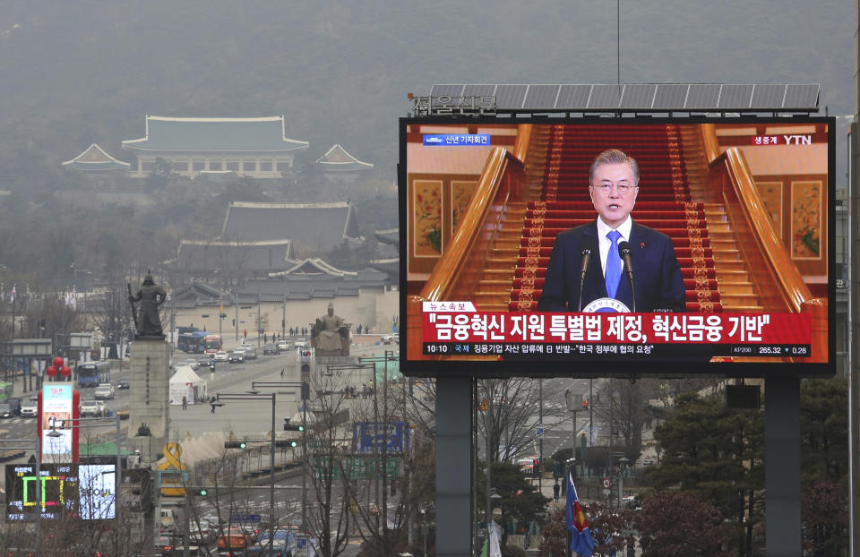 In this Thursday, Jan. 10, 2019, file photo, a TV screen shows the live broadcast of South Korean President Moon Jae-in's press conference in Seoul, South Korea. Moon has suggested he'll push for sanction exemptions to restart dormant economic cooperation projects with North Korea. The signs read" Finance Innovation." (AP Photo/Ahn Young-joon, File)