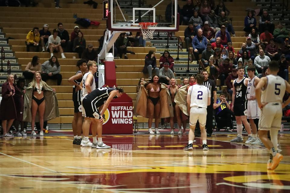 Members of the Northern State women's basketball team "flash" Winona State's Connor Dillon as part of the I Hate Winter tradition inside Wachs Arena on Jan. 22, 2022.