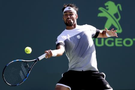 Mar 29, 2017; Miami, FL, USA; Fabio Fognini of Italy hits a forehand against Kei Nishikori of Japan (not pictured) on day nine of the 2017 Miami Open at Crandon Park Tennis Center. Fognini won 6-4, 6-2. Mandatory Credit: Geoff Burke-USA TODAY Sports