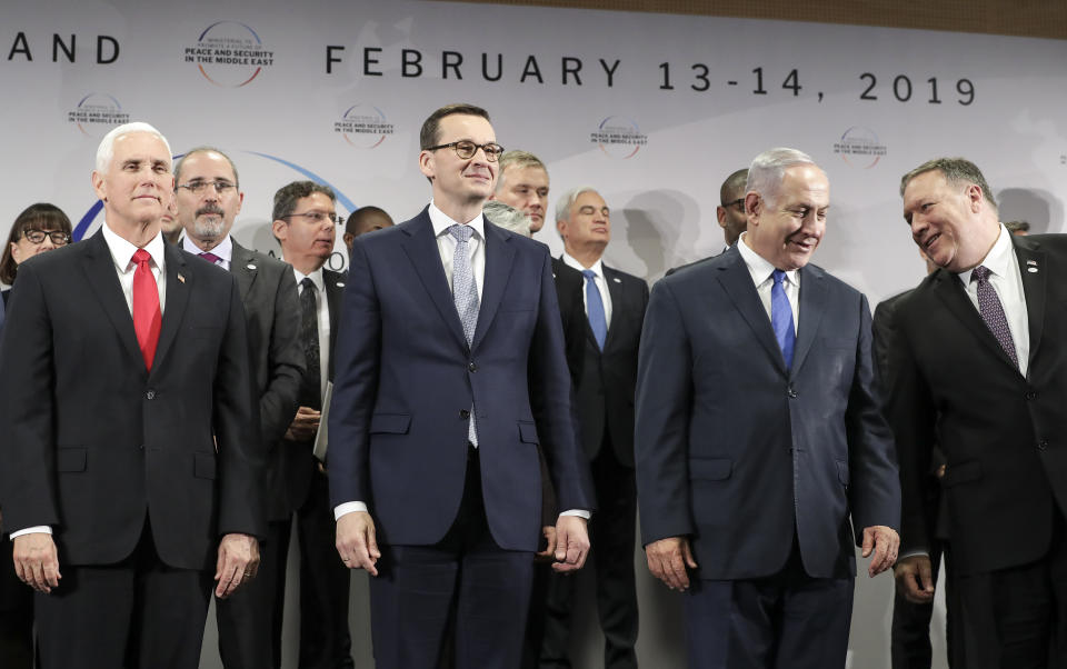 FILE - In this Thursday, Feb. 14, 2019 file photo, United States Vice President Mike Pence, Prime Minister of Poland Mateusz Morawiecki, Israeli Prime Minister Benjamin Netanyahu and United State Secretary of State Mike Pompeo, from left, stand on a podium at a conference on Peace and Security in the Middle East in Warsaw, Poland. A two-day security conference in Warsaw was supposed to be a crowning achievement for Israeli Prime Minister Benjamin Netanyahu, stamping a seal on his long-held goal of pushing his behind-the-scenes ties with Arab leaders into the open. Instead, the publicity-seeking Israeli leader made one embarrassing misstep after another, distracting attention from his main mission and sending his aides into a nonstop cycle of damage control. (AP Photo/Michael Sohn, File)