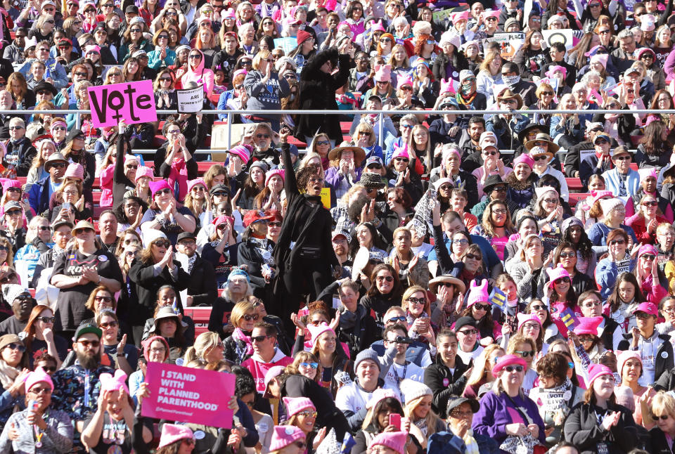 <p>The crowd at Sam Boyd Stadium had the feel of a mellow, happy concert — with lots of pussy hats. (Photo: Ronda Churchill for Yahoo Lifestyle) </p>