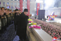 In this photo provided by the North Korean government, North Korean leader Kim Jong Un waves his hand towards people during a military parade at Kim Il Sung Square in Pyongyang, North Korea, Wednesday, Feb. 8, 2023. Independent journalists were not given access to cover the event depicted in this image distributed by the North Korean government. The content of this image is as provided and cannot be independently verified. Korean language watermark on image as provided by source reads: "KCNA" which is the abbreviation for Korean Central News Agency. (Korean Central News Agency/Korea News Service via AP)