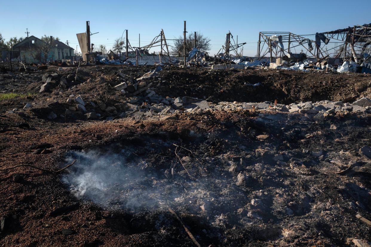 Smoke rises from ruins of a private farm after a Russian rocket attack in the village of Kiseliovka close to Kherson (Copyright 2023 The Associated Press. All rights reserved.)