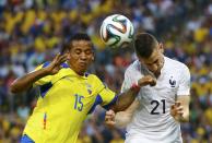 France's Laurent Koscielny (R) fights for the ball with Ecuador's Michael Arroyo during their 2014 World Cup Group E soccer match at the Maracana stadium in Rio de Janeiro June 25, 2014. REUTERS/Kai Pfaffenbach