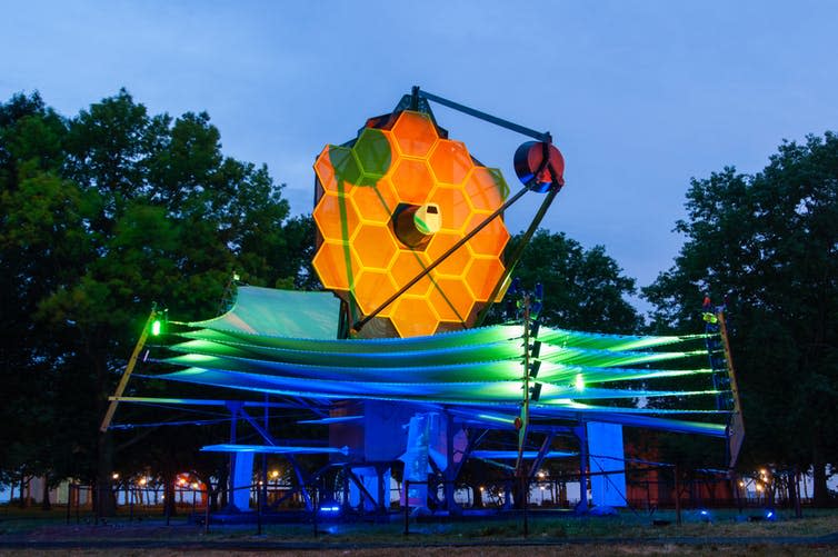 <span class="caption">An illuminated full scale model of the James Webb Telescope.</span> <span class="attribution"><a class="link " href="https://www.shutterstock.com/image-photo/james-webb-telescope-illuminated-night-full-1202860798" rel="nofollow noopener" target="_blank" data-ylk="slk:Bobby Bradley/Shutterstock;elm:context_link;itc:0;sec:content-canvas">Bobby Bradley/Shutterstock</a></span>