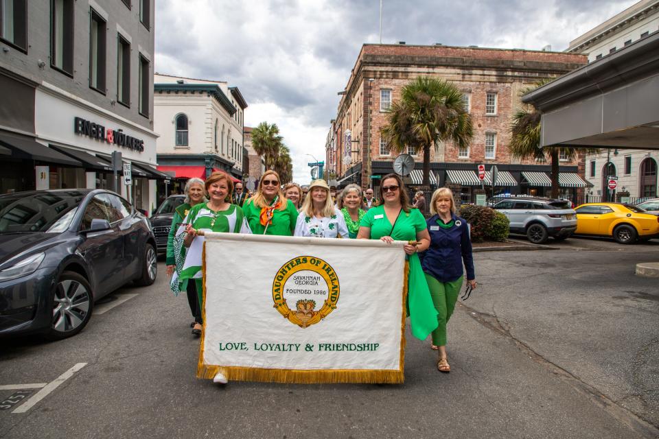 Amy Hatch, President Teri Osborne, Vice President Deana Shores, Janice Sauers, Betty Goette, Connie Bar, Sally Welsh, Hannah Shores, and Debbie Carroll from Daughters of Ireland proudly march, on Saturday, February 24, 2024, in Savannah, GA.