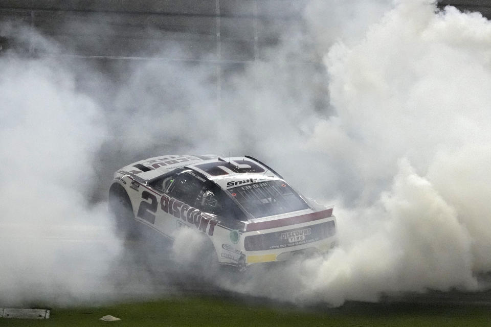 Austin Cindric celebrates after winning the NASCAR Daytona 500 auto race Sunday, Feb. 20, 2022, at Daytona International Speedway in Daytona Beach, Fla. (AP Photo/Chris O'Meara)