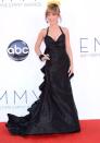 The Queen of the D-listers looked pretty close to A-list on Emmys night in her black crepe halter gown with a dramatic train and a plunging neckline that showed off her, er, assets.