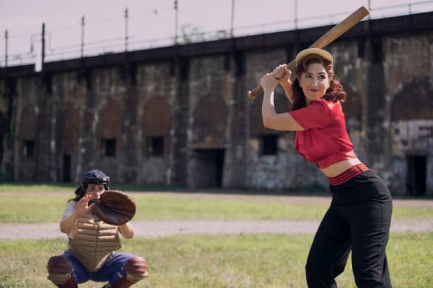 D'arcy Carden as Greta Gill at bat with Abbi Jacobson as catcher Carson Shaw in "A League of Their Own"<p>Prime Video</p>