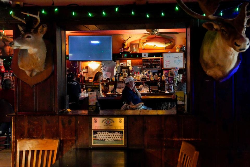 Customers enjoy the afternoon at Rustic Cabins Bar in Grosse Pointe on Monday, July 31, 2023. 