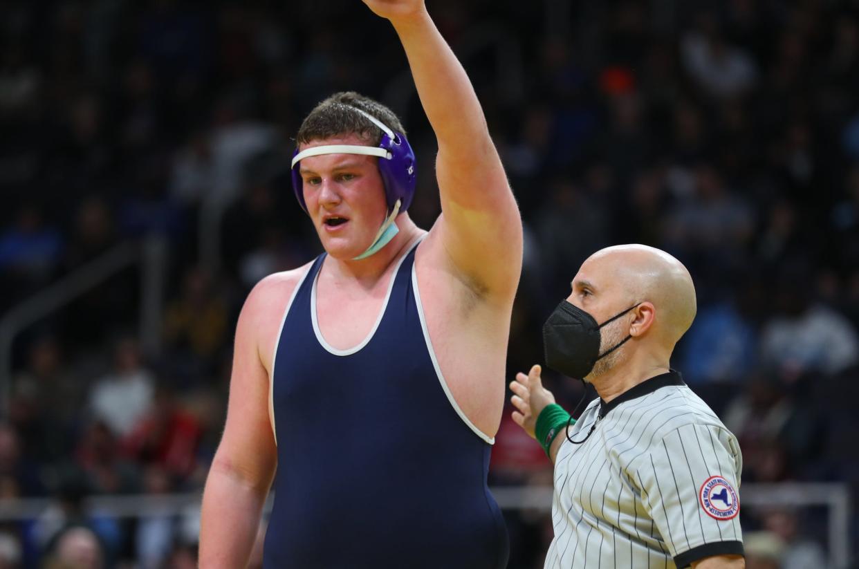 New Hartford Spartan Charles Tibbits has his hand raised as the Division II 285-pound champion Saturday at the NYSPHSAA wrestling championships in Albany.