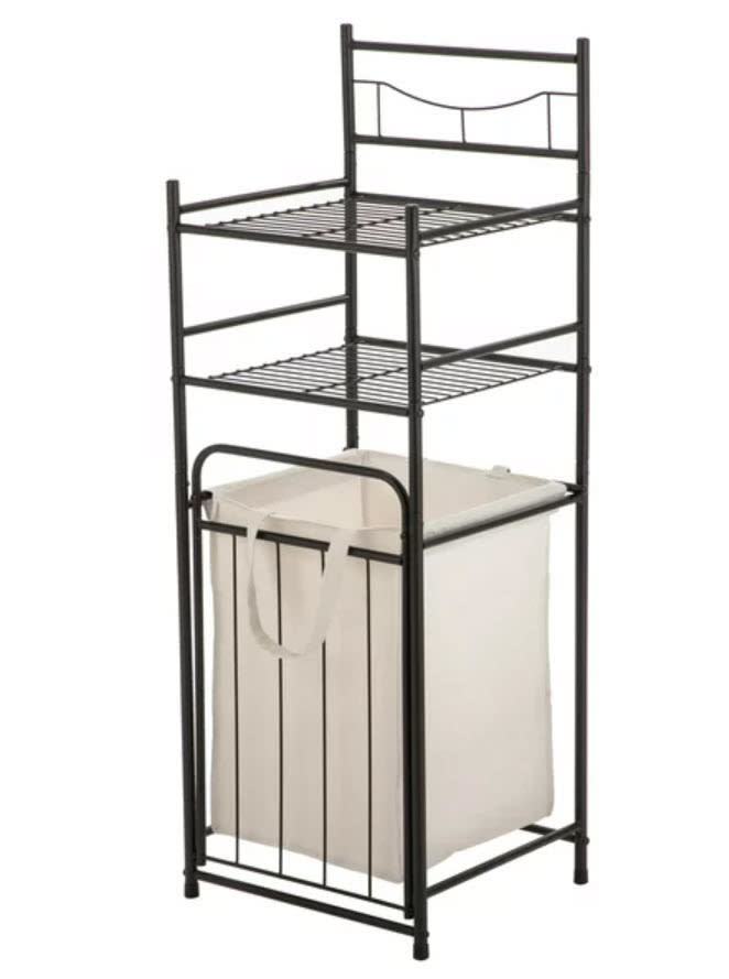 a bathroom shelf with built-in hamper