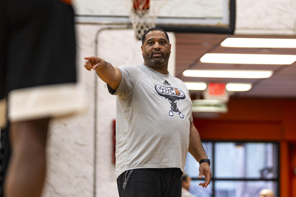 Book Richardson, director of the New York Gauchos boy's basketball program, runs a practice session at the Gaucho Gym, Monday, March 11, 2024, in the Bronx borough of New York. Book Richardson doesn’t sleep much past 5:30 a.m. anymore. That was around the time seven years ago that FBI agents pounded on his door, barged in, handcuffed him and dragged him away while his 16-year-old son, E.J., looked on helplessly.(AP Photo/Peter K. Afriyie)