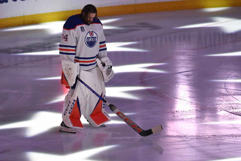 Edmonton Oilers goaltender Stuart Skinner (74) stands on the ice before Game 1 of the team's NHL hockey Stanley Cup Finals against the Florida Panthers, Saturday, June 8, 2024, in Sunrise, Fla. (AP Photo/Michael Laughlin)