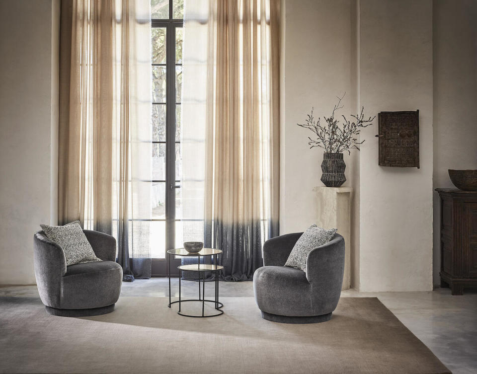 The Ombre Wool rug in Saturn, chairs in Antoinette fabric in Gauntlet and drapes in Ombre Alpaca Linen Glam Sheer fabric in Nightlife by Rosemary Hallgarten