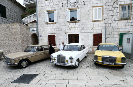 People get into an old-timer Mercedes car in Imotski, Croatia, May 19, 2019. REUTERS/Antonio Bronic