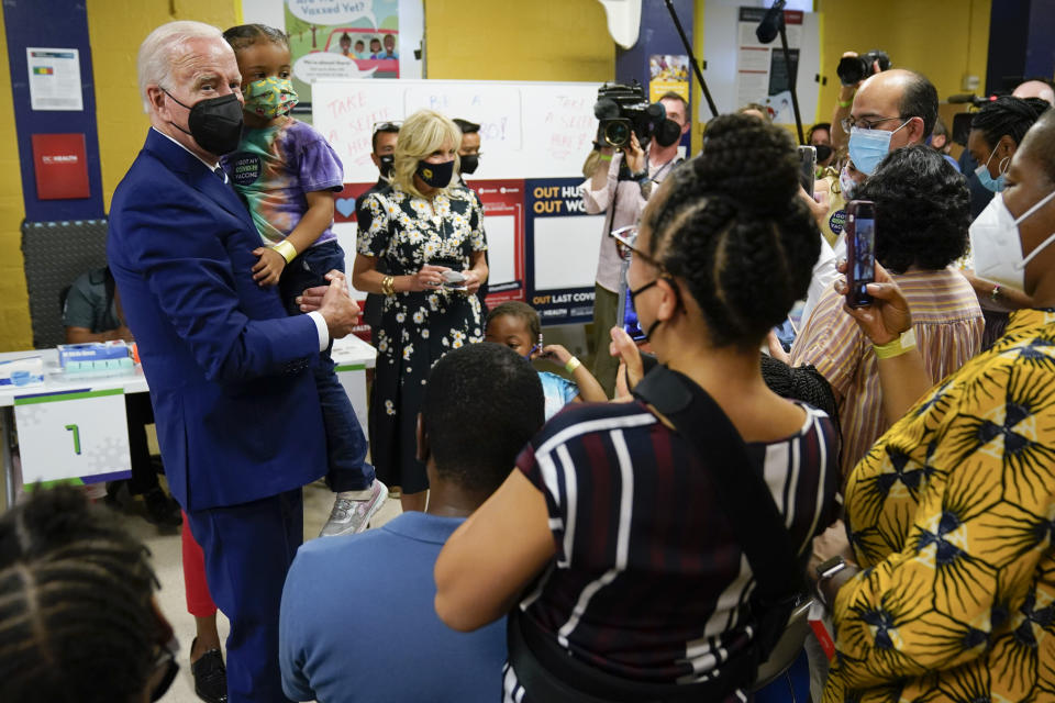 President Joe Biden and first lady Jill Biden visit a COVID-19 vaccination clinic at the Church of the Holy Communion Tuesday, June 21, 2022, in Washington. (AP Photo/Evan Vucci)