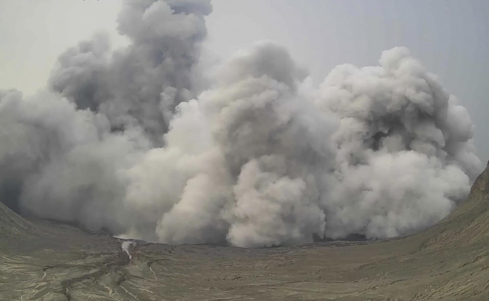 In this image from video released by the Philippine Institute of Volcanology and Seismology - Department of Science and Technology, a plume of steam and ash rises from Taal Volcano, Batangas province, Philippines on Thursday, July 1, 2021. A tiny volcano near the Philippine capital belched a plume of steam and ash into the sky in a brief explosion Thursday, prompting an alert level to be raised due to heightened risks to nearby villages. (Philippine Institute of Volcanology and Seismology - Department of Science and Technology via AP)