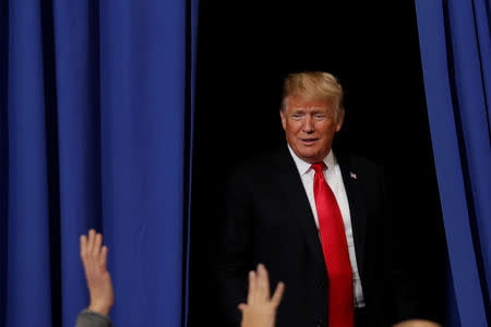 U.S. President Donald Trump arrives for a campaign rally at Southport High School in Indianapolis, Indiana, U.S. November 2, 2018. REUTERS/Carlos Barria