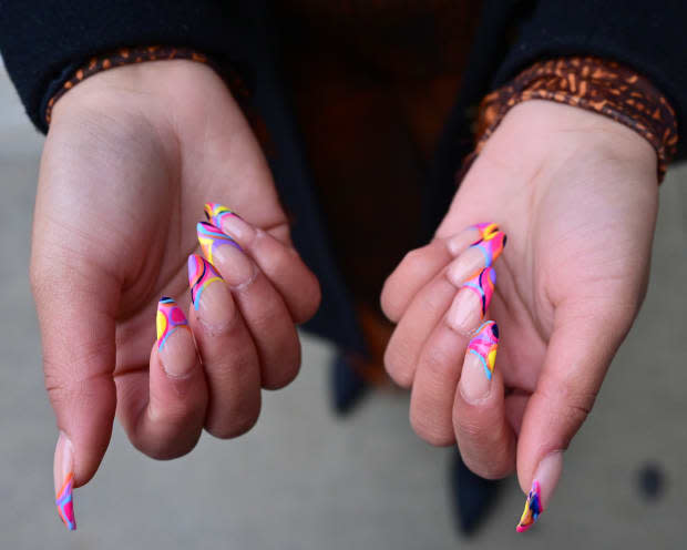 A guest displays graphic, Pucci-inspired nail art at Spring Studios at New York Fashion Week.<p>Shannon Finney/Getty Images</p>