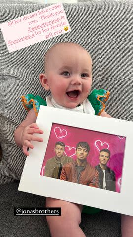 <p>Kaley Cuoco/Instagram</p> Matilda gifted with Jonas Brothers frame