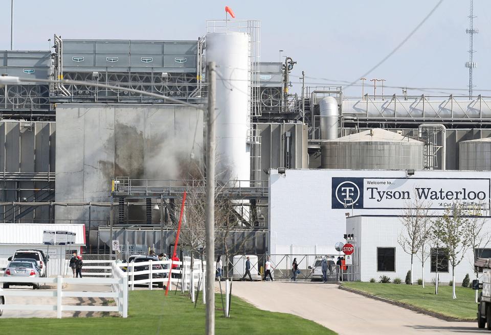 Tyson's Fresh Meat workers file in for a tour of safety measures put into place after the plant had to shut down due to a Covid 19 outbreak, Wednesday, May 6, 2020, in Waterloo, Iowa. On Tuesday, state officials announced that nearly 1,400 workers at three Tyson Foods pork processing plants in Iowa had tested positive for the virus.  (Brandon Pollock/The Courier via AP)