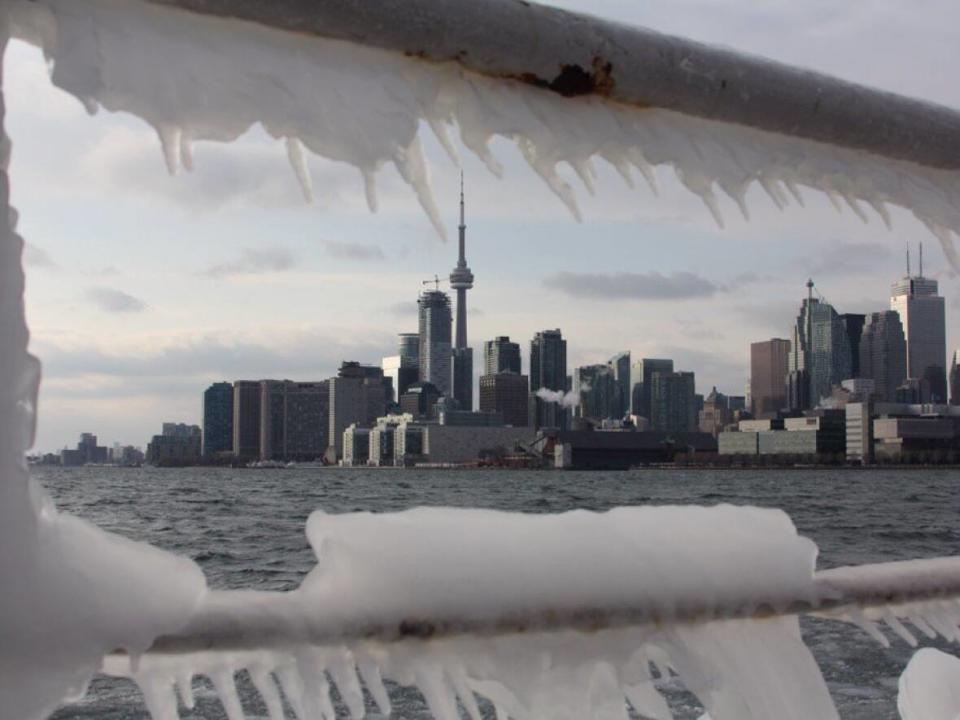 Toronto police are urging people to stay off the ice on Lake Ontario after a group of people fell through into the water. (Michael Cole/CBC - image credit)