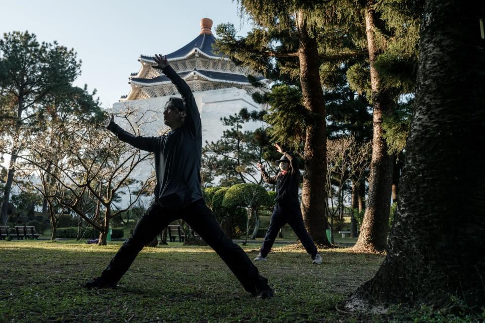 Person in nature practicing qigong