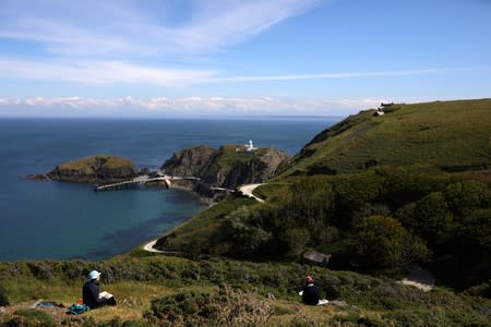 People take part in a 'Cloud Sketching' workshop during the Cloud Appreciation Society's gathering in Lundy