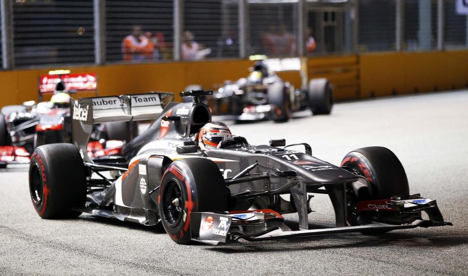 Sauber Formula One driver Nico Hulkenberg of Germany races during the Singapore F1 Grand Prix at the Marina Bay street circuit in Singapore September 22, 2013. REUTERS/Natashia Lee (SINGAPORE - Tags: SPORT MOTORSPORT F1)