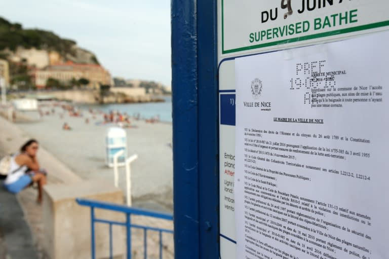This picture taken on August 19, 2016 shows the bylaw forbidding women to wear Burkini at the beach in Nice, southeastern France
