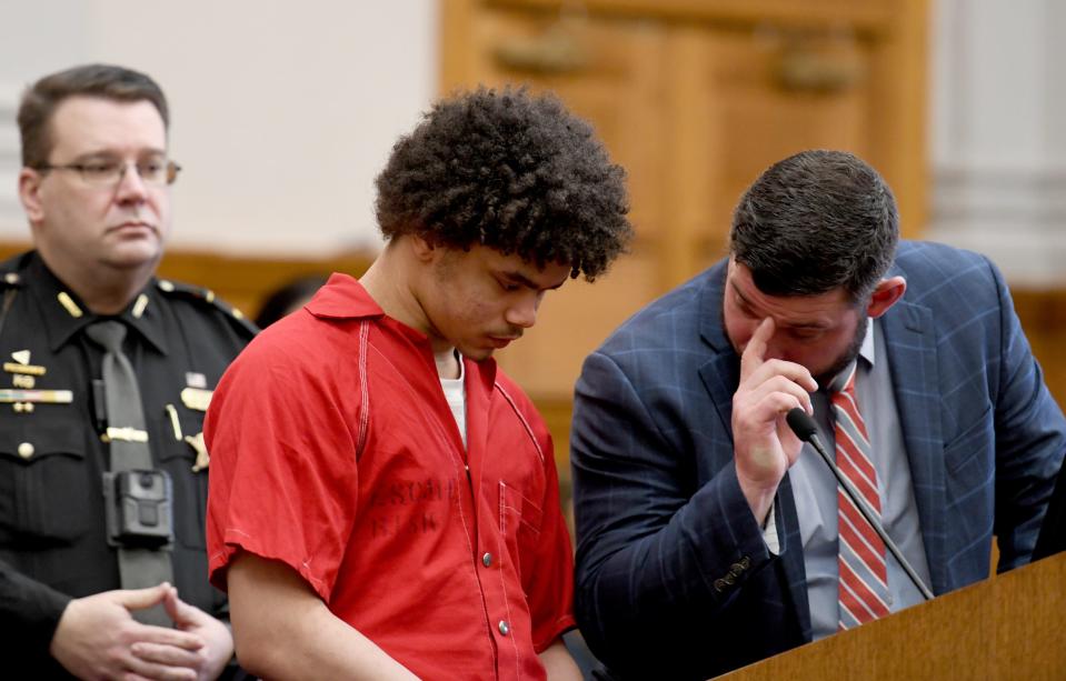 Anthony Hinton with his defense attorney, Ty Graham, stands before Common Pleas Judge Chryssa Hartnett and pleaded guilty to felony carrying a concealed weapon. The state dropped charges of felony murder and felonious assault after video evidence showed the victim pointed a gun at Hinton before Hinton fired.