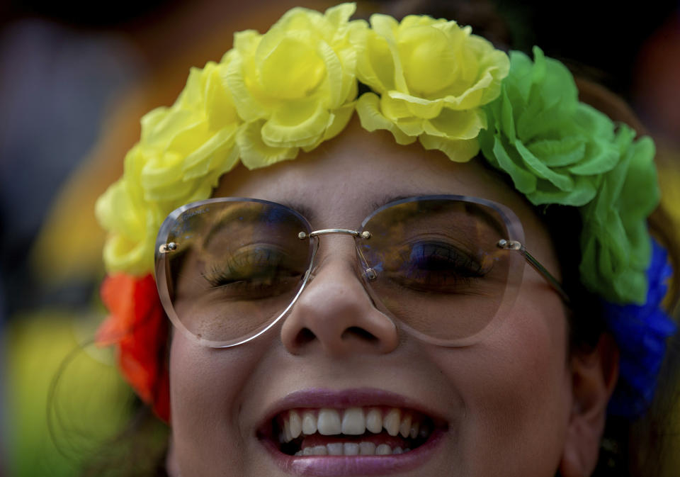 A reveler wears a diadem with colors of the rainbow during the gay pride parade in Mexico City, Mexico, Saturday, June 29, 2019. (AP Photo/Fernando Llano)