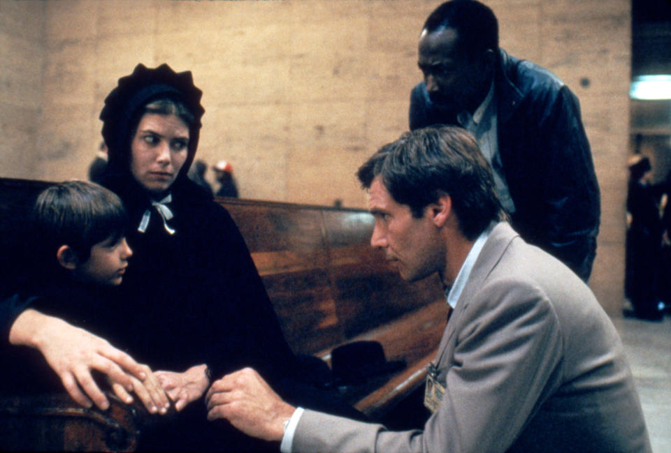 American actors Lukas Haas, Kelly McGillis and Harrison Ford on the set of Witness, directed by Peter Weir. (Photo by Sunset Boulevard/Corbis via Getty Images)