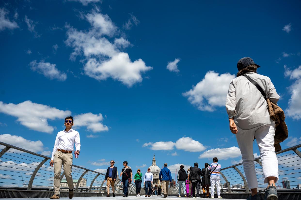 London, UK.  17 June 2024.  UK Weather – People cross the Millennium Bridge under blue skies and warm temperatures, with St Paul's Cathedral in the distance.  The capital has experienced cooler conditions and heavy rain recently, but the Met Office forecast is for more warmer, settled and drier weather for the next week.  Credit: Stephen Chung / Alamy Live News