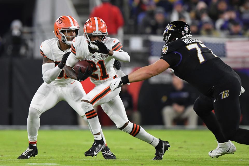 Browns cornerback Denzel Ward runs the ball after a second-quarter interception against the Ravens, Sunday, Nov. 28, 2021, in Baltimore. (AP Photo/Terrance Williams)