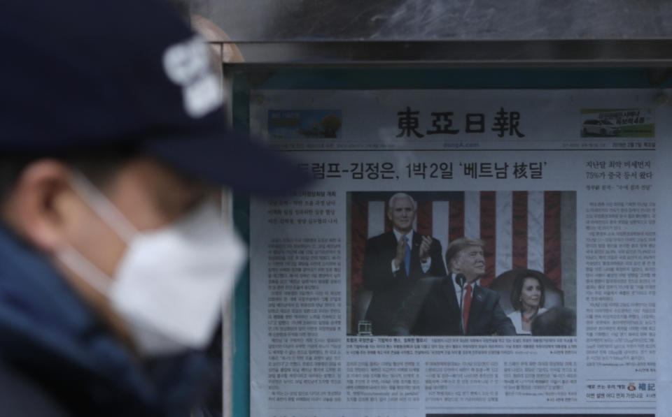 A man walks by a newspaper reporting U.S. President Donald Trump delivering his State of the Union address, displayed on a street in Seoul, South Korea, Thursday, Feb. 7, 2019. With the next meeting between Trump and North Korean leader Kim Jong Un set for Feb. 27-28 in Vietnam, there’s hope and caution in South Korea on whether the leaders could agree to tangible steps toward reducing the North’s nuclear threat after a year of soaring but fruitless talks. (AP Photo/Lee Jin-man)