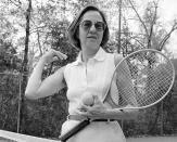 FILE - In this Dec. 9, 1979, file photo, Gladys Madalie Heldman stands on a tennis court in Houston. Tennis promoter Heldman and Philip Morris helped the “Original 9” women form the Virginia Slims circuit in September 1970. (AP Photo/EFK, File)